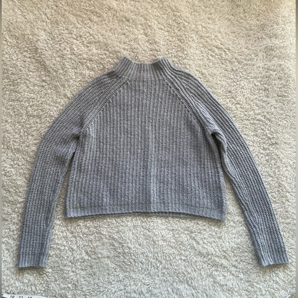 Cropped gray knitted mock neck sweater